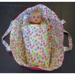 reiswieg geel apen met hard roze voor poppen van 40t/m 48cm